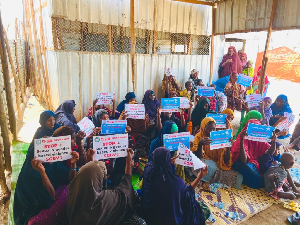 Participants holding STOP SGBV signs